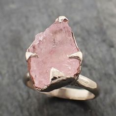 Raw Rough Morganite solitaire 14k white gold Ring Gold Pink Gemstone Cocktail Ring Statement Ring Raw gemstone Jewelry byAngelineRaw rough morganite feels so soft gentle and loving. I hand carved this ring in wax and cast it in solid rose gold using the lost wax casting process. This one of a kind ring is a size 7 and It can be resized. The stone measures about 13mm X 9mm.Throughout all time and history, in every tribe and culture all around the world crystals, minerals and gemstones have used f Custom Gemstone Rings, Rough Gemstone Jewelry, Pink Wedding Rings, Stone Wedding Ring, Rose Gold Diamond Ring Engagement, Raw Gemstone Jewelry, Raw Gemstone Ring, Stone Wedding, Morganite Diamond