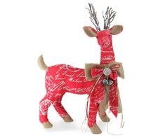 a red and white reindeer ornament on a white background