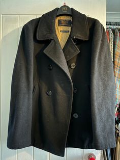 This J.CREW BAYSWATER PEA COAT is the perfect addition to any man's wardrobe. Made with thick black wool, this coat is warm and stylish. The military-grade construction ensures durability and longevity. The coat is a size M and has a regular fit. The black color is versatile and can be dressed up or down. The pea coat style is timeless and will never go out of fashion. This coat is perfect for winter weather and will keep you warm and stylish for years to come. Excellent gently used condition. S Coat Style, M J, Winter Weather, Military Grade, Men's Wardrobe, Pea Coat, Black Wool, Black Color, Mens Jackets