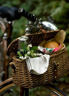 a bicycle with a basket full of food