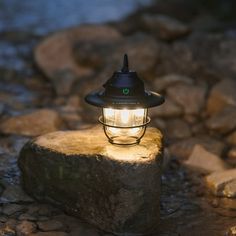 a light that is sitting on some rocks