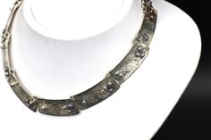 Vintage  Handmade Silver Brutalist Women's Choker Necklace Total weight: 57.78 grams  DON'T FORGET TO FAVOURITE OUR SHOP TO STAY UP-TO-DATE ON OUR LATEST ESTATE CLEARANCES & FINDINGS. MAKE SURE TO CHECK OUT OUR LATEST VINTAGE JEWELRY COLLECTION! Designer name jewelry, custom jewelry & much more! Make sure to follow our shop on Etsy for our latest Estate clearances and findings!  #vintage_montreal_jewelry (insta) OFFERS ACCEPTED ON SELECTED ITEMS ONLY. SEND ME AN OFFER WITH YOUR LOCATION AND I'LL GET BACK TO YOU ASAP Designer Metal Necklaces For Gifts, Designer Handmade Sterling Silver Jewelry, Designer Silver Collectible Jewelry, Designer Metal Necklaces For Formal Occasions, Designer Hallmarked Jewelry For Collectors, Unique Metal Hallmarked Necklaces, Hammered Metal Jewelry For Formal Occasions, Unique Hand Forged Necklaces For Formal Occasions, Unique Hand Forged Necklaces For Formal Events