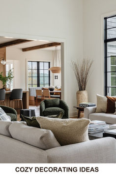 a living room filled with furniture and lots of windows