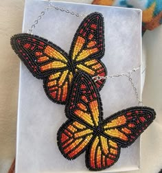 the beaded butterfly necklace is on display