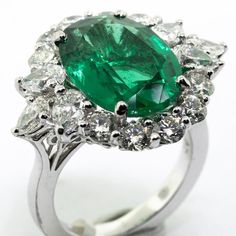 This Dazzling and Substantial Emerald Ring Features a Extra Extra Fine Emerald Center Stone with 3.06ct Diamond Side Stones. An Excellent Choice for any Occasion!!! All of the Stones are Beautifully White and Display Absolutely Phenomenal Sparkle! The Sizable Oval Cut Emerald is Certified by GIA!!! The World's Premier Gemological Authority!!! See the pictures for the exact GIA Certificate that goes with the ring. The Ring is being sold from Da Vinci Fine Jewelry, Inc., with a Gift Box, GIA Certi Dazzling Oval Emerald Ring In Platinum, Luxury Oval Emerald Ring With Diamond Cut, Oval Emerald Ring With Diamond Cut In Platinum, Dazzling Oval Emerald Ring With Brilliant Cut, Gia Certificate, Emerald Ring, Oval Cut, Beautiful Jewelry, Emerald