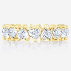 This heart shaped diamond eternity band makes a perfect wedding band or right hand ring. Made to order in platinum or gold with diamonds of all sizes and qualities. Platinum or 14k solid gold Diamonds: G/H color VS clarity 3.66 carats, 18 diamonds (~.20 pt each) Carat total weights based on finger size 6 4.35 mm width We recommend ordering 1/4 of a size up from your true finger size to avoid a snug fit, as eternity bands cannot be resized This item is Final Sale and excluded from all promotional Classic Cushions, Necklace Length Guide, Right Hand Ring, Bracelet Size Chart, Kids Rings, Diamond Eternity Band, Kids Bracelets, Right Hand Rings, Hand Ring