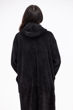 The Drift Away Hoodie is a closet must have. This faux fur hoodie features a super longline body, large pockets, an elasticized wrist cuff, and a straight hem. The Drift Away Hoodie is perfect for a ay of lounging or can be used as a toasty robe! Fabric: 100% Polyester One size fits most! Cozy Fit Outerwear With Adjustable Hood For Loungewear, Comfy Outerwear With Adjustable Hood For Loungewear, Comfy Hooded Outerwear With Kangaroo Pocket, Cozy Hooded Jacket With Adjustable Hood For Loungewear, Black Outerwear With Kangaroo Pocket For Loungewear, Solid Outerwear With Kangaroo Pocket For Loungewear, Solid Color Outerwear With Kangaroo Pocket For Loungewear, Oversized Outerwear With Adjustable Hood For Loungewear, Winter Hooded Jacket With Kangaroo Pocket For Loungewear