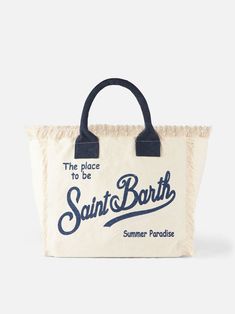 Vanity canvas shoulder bagWhite and light blue stripesSaint Barth blue logo printInside pocket with zipSizes: 40cm x 32cm x 20cm | MC2 Saint Barth Women's Vanity Canvas Shoulder Bag With Saint Barth Print in White | SS18 Saint Barth Bag, St Barths, Summer Paradise, Saint Barth, Blue Logo, Canvas Shoulder Bag, White Bag, Blue Stripes, Inside Pocket