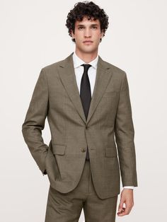 This sophisticated Italian wool suit jacket stands up to warm weather with a luxurious tropical wool fabric—a fabric beloved for its distinctive balance between an open weave and a tighter tension yarn, which gives it the ability to remain breathable while always looking pulled-together.  Tailored Slim Fit: More relaxed than our Slim Fit, this Italian cut style has a softer shoulder construction.  Fabric from Italy's Vitale Barberis Canonico.  Notch lapel with 2-button front.  Three exterior poc Brown Suit Wedding, Sound Of Music Costumes, Brown Suits For Men, Construction Fabric, Brown Suits, Suits And Jackets, Open Weave, Wool Suit, Wool Fabric