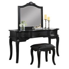 a black vanity with mirror and stool