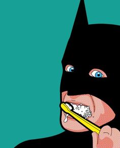 a person wearing a batman mask brushing their teeth with a yellow toothbrush in front of them