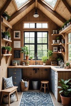 a kitchen with lots of plants in it