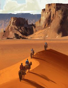 three people are riding horses in the desert