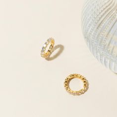 Our Christy Ring is so feminine and glamorous, it'll spruce up even your most basic outfit. Throw it on with a few other minimal stacking rings, and your look is complete. • Material: High-Quality Solid 925 Sterling Silver• Finish: 18K Gold• Featuring 2.5 Eternity CZ Diamond Band SKU: RR-RR033 Everyday White Gold Huggie Rings, Stackable Yellow Gold Crystal Ring, Everyday Hoop Rings With Prong Setting, Dainty 14k Gold Huggie Rings, Minimalist Hoop Rings With Halo Detail, 14k Gold Halo Huggie Rings, Minimalist Hoop Rings With Halo, Dainty Tarnish-resistant Huggie Rings, Wedding Rings With Vvs Clarity Huggie