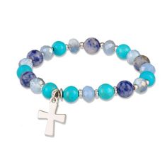 Shades of blue stretch bracelet brings the colors of the ocean and sky together; embellished with cross charmBeads in shades of light blue, turquoise, sky blue and dark blue with silver spacersSilvertone charm crossContemporary look for today's Christian woman Bracelet With Cross, Diy Jewelry Display, Shades Of Light Blue, Christian Woman, Turquoise Bead Bracelet, Shades Of Light, Bird Necklace, Gifts For Your Boyfriend, Christian Jewelry