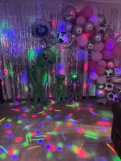 a party room with balloons, streamers and lights