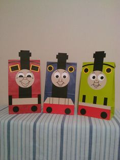 three paper bags shaped like thomas the train