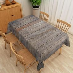 a wooden table and chairs in a room