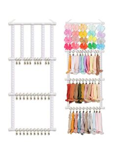 two white racks with different colored ribbons hanging from the top and one is holding several pairs of