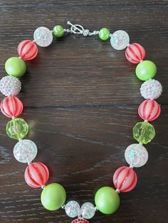 "How The Grinch Stole Christmas Inspired Children's Chunky Bubblegum Bead Necklace & Bracelet Set/ Holidays This very cute Christmas Grinch Necklace & Bracelet Set is a perfect addition to any holiday outfit and the holiday season. The Necklace is made up primarily of 20mm beads in shades of red, green and white. The necklace measures approximately 11\" when toggled around neck including the Grinch pendant. The Bracelet is an elastic bracelet, doubled up for extra strength. The Necklace Adjustable Multicolor Christmas Jewelry, Adjustable Multicolor Jewelry For Holiday, Multicolor Round Beads Christmas Jewelry, Christmas Party Beaded Necklaces With Round Beads, Christmas Party Round Bead Necklaces, Festive Christmas Beads With Round Shape, Festive Christmas Beads, Christmas Festive Round Beads, Multicolor Round Beads Jewelry For Holidays