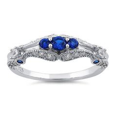 Top of ring height: 6mm

Band width: 1.9mm

Shank width: 1.6mm


 



Stone material: blue & clear cubic zirconia



Center stone size: 3.2mm



Stone size: round cut



Center stone carat weight: .11 ct



Total number of CZ stones: 29



Stone setting: prong setting



 



Metal: 925 sterling silver



Plating: rhodium plated 



Finish: high polish Blue Cubic Zirconia Promise Ring, Blue Cubic Zirconia Rings With Diamond Accents, Blue Cubic Zirconia Birthstone Promise Ring, Cubic Zirconia Sapphire Ring For Promise, Brilliant Cut Sapphire Birthstone Ring In Cubic Zirconia, Sapphire Cubic Zirconia Promise Ring With Center Stone, Sapphire Birthstone Ring With Brilliant Cut Cubic Zirconia, Sapphire Cubic Zirconia Birthstone Ring With Brilliant Cut, Blue Cubic Zirconia Birthstone Ring With Center Stone