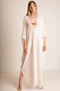 Deep V neck, flowing caftan in a semi sheer, loosely woven cotton gauze with a window pane pattern. Fabric is 100% cotton. This item is one size Bohemian Oversized Linen Dress For Beach, Bohemian Linen Dress For Vacation, Oversized Linen Tunic Dress For Beach, Bohemian Oversized Kaftan For Daywear, Oversized Bohemian Linen Beach Dress, Long Linen Beach Dress, White Linen Dress For The Beach, Long Bohemian Linen Beach Dress, White Ramie Linen Dress For Beach