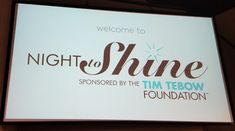 there is a sign that says night to shine sponsored by the tim tebow foundation