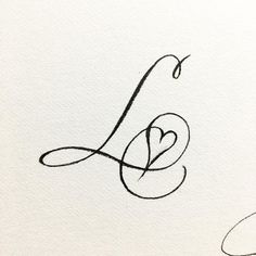 the letter l is written in cursive writing with a heart on it's side