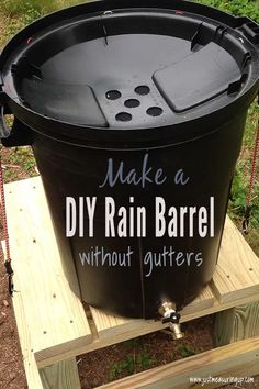 a large black barrel sitting on top of a wooden pallet