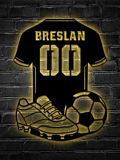 a black shirt and soccer shoe on a brick wall with the words breslan 00