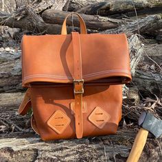 "This beautiful, all leather backpack is made using a soft & pliable full-grain leather for the body. All of the straps and handles are made using full grain bridle leather. This all-purpose backpack is the perfect size for any hiking / backpacking trip or even school! Seams are double stitched and all rivets are hand-peened solid brass for superior strength. The bag includes two lashing tabs on the front at the bottom for attaching additional bags or equipment. Buckles are brass with roller Outdoor Leather Backpack With Adjustable Strap, Leather Backpack With Leather Backing For Outdoor, Leather Satchel Backpack For Outdoor, Leather Backpack With Adjustable Strap For Outdoor, Leather Backpack With Waxed Finish For Everyday, Everyday Carry Soft Leather Backpack, Soft Leather Everyday Backpack, Everyday Soft Leather Backpack, Adventure Leather Backpack With Leather Handles