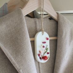 a close up of a coat with flowers on it