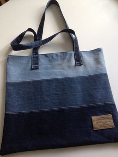 a denim bag sitting on top of a table