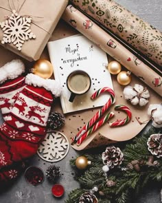 an assortment of christmas decorations and gifts on a table