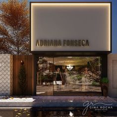 the front entrance to an italian fashion store with its reflection in the glass door and trees