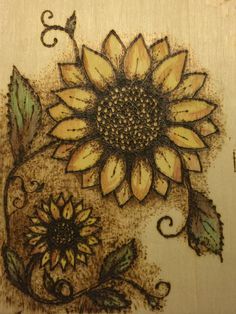 a drawing of a sunflower with leaves and swirls on it's side