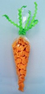 a plastic bag filled with carrots sitting on top of a table