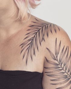 a woman with a tattoo on her shoulder