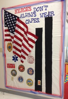 a bulletin board with flags and patches on it