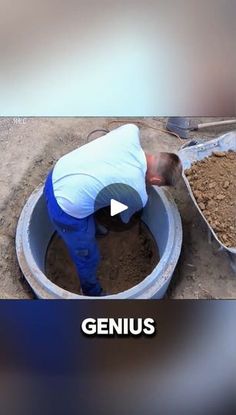 a man in blue pants and white shirt pouring cement into a large bucket with the word genius on it