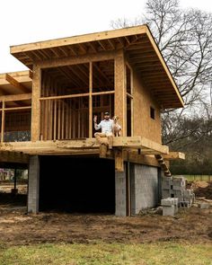 a man standing on top of a building under construction