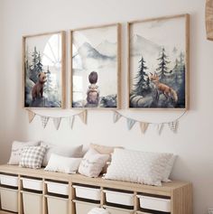 three paintings hang on the wall above a wooden bench with pillows and baskets underneath it