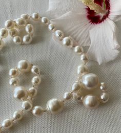 "These pearls are lustrous and glowing baroque, white genuine South Seas pearls. They range from 7.5 mm to 15.2 mm in size (example measurements in photos). I designed this to have waves of pearls, small to large. The clasp is silver and fishhook style, for a total length of 20.25\". Please note there are natural blemishes on these pearls." Pearl White Pearl Necklace With Pearl Drop, Classic Baroque Pearl Bracelet For Formal Occasions, Formal White Pearl Bracelet With Pendant, Baroque Pearl Necklace For Formal Occasions, Round Mother Of Pearl Necklace For Anniversary, Handmade Round Beads Pearl Necklace For Formal Occasions, White Pearl Necklace With Round Beads For Formal Occasions, Mother Of Pearl Anniversary Pearl Necklace, Classic Handmade Pearl Necklace With Round Beads