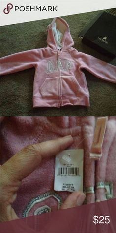 Baby GAP fleece zip up hoodie Size 4 t brand new with tags full zip baby Gap fleece hoodie. GAP Shirts & Tops Sweatshirts & Hoodies Cute Gap Tops For Fall, Gap Tops For Playtime In Fall, Gap Tops For Fall Playtime, Cute Cotton Outerwear By Gap, Gap Long Sleeve Tops With Adjustable Hood, Gap Cotton Hooded Top, Gap Pink Hoodie, Pink Gap Sweatshirt For Winter, Cute Gap Cotton Outerwear