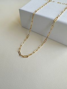 "Dainty Gold Filled paper clip chain necklace.    --------------------------------------------- >>  Length: 40cm or 45cm >>  Material: 14k gold filled   >>  Chain Dimensions: 2.5mm x 6.5mm >>  Hypoallergenic,nickel free,sensitive skin friendly&tarnish resistant. ------------------What is gold filled ------------------ Most of our findings and wires are made with 14k gold filled.\"Gold-filled\" is a USA industry standard that legally requires 5% pure gold by weight. It is a solid layer of gold bonded to another metal through heat and pressure. It does not wear off or turn colours over time, and if taken care of properly it can last a lifetime.Gold-filled jewellery is a cheaper, yet the best alternative to solid gold. It's hypoallergenic and water-safe." Minimalist Paperclip Chain Necklace As Gift, Minimalist Paperclip Chain Necklace For Gift, Minimalist Paperclip Chain Necklace Gift, Paperclip Chain Necklace As A Gift, Gold Chain Paperclip Necklace For Gifts, Classic Paperclip Chain Necklace As Gift, Gift Paperclip Chain Necklace, Paperclip Chain Necklace With Adjustable Chain As Gift, Gold Paperclip Chain Necklace With Box Chain