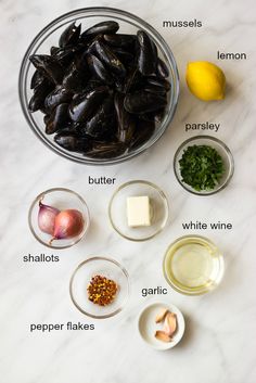 the ingredients needed to make an eggplant recipe on a white marble countertop