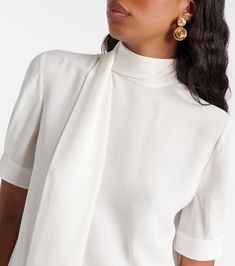 Find VALENTINO Silk Georgette Blouse on Editorialist. Material: 100% silk. Care instructions: dry clean. Made in Italy. Designer color name: Avorio. Comes with garment bag. Semi-formal White Silk Blouse, White Silk Blouse For Semi-formal Occasions, Formal Silk Tie Neck Blouse, Formal Silk Tie-neck Blouse, Silk Tie Neck Blouse For Formal Occasions, Elegant Silk Tie Neck Top, Luxury Silk Blouse For Office, Formal Silk Feminine Blouse, Formal Silk Blouse Feminine Style