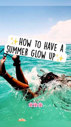 a woman swimming in the ocean holding a sign that says how to have a summer glow up