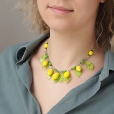 "This Lemon necklace is made of glass in the lampwork technique. This glass fruit necklace is stylish and elegant and will become a bright addition to your outfits! 💕 You will definitely look stunning in this citrus necklace! Dimentions: the necklace length is adjustable, 16\"-19\" inch (40-48cm). The silver colored chain is made of stainless steel and is hypoallergenic. Materials: artist lampwork glass beads, stainless steel and metal fittings. 🎁 This statement yellow necklace will also be a Handmade Lime Green Necklace Gift, Fruit Necklace Jewelry, Handmade Lemon Color Dangle Jewelry, Green Glass Pendant Necklace, Lemon Necklace, Lime Green Necklace, Fruit Necklace, Glass Fruit, Yellow Necklace