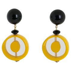 These lovely Angela Caputi pierced earrings, made in Italy, feature a 1970s revival-inspired design with geometric resin pebbles. Each rounded pebble bead is carved and slightly domed. The color scheme is playing on a yellow pineapple tone, either plain or transparent, contrasted with tiny black beads and fastenings. These earrings are for pierced ears. Her color matching is always extremely classy, perfect for casual and fancy occasions. As you know, Caputi jewelry is not signed. These earrings Butterfly Chandeliers, Yellow Pineapple, Arabesque Design, Pink Sapphire Earrings, Lucite Jewelry, Sapphire And Diamond Earrings, New York Museums, Black Jewel, Gold Cushions